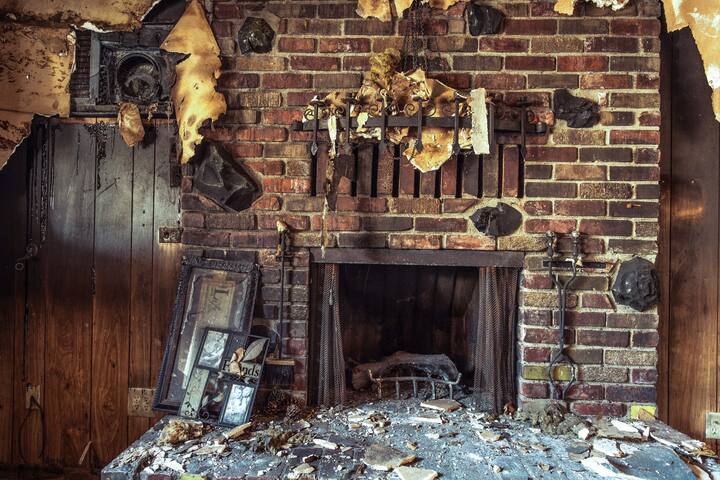 Fire has wrecked a beautiful fireplace and now the homeowners need smoke damage repair